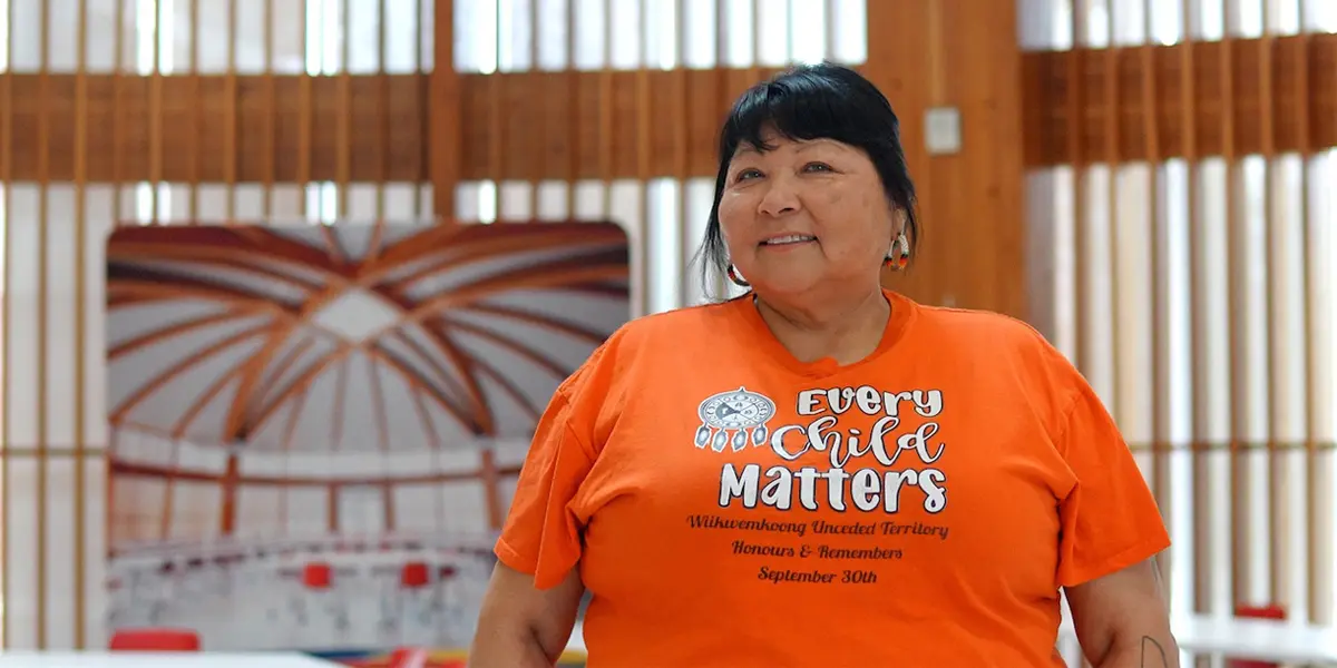 Roxanne Recollet standing in the Indigenous Sharing and Learning Centre