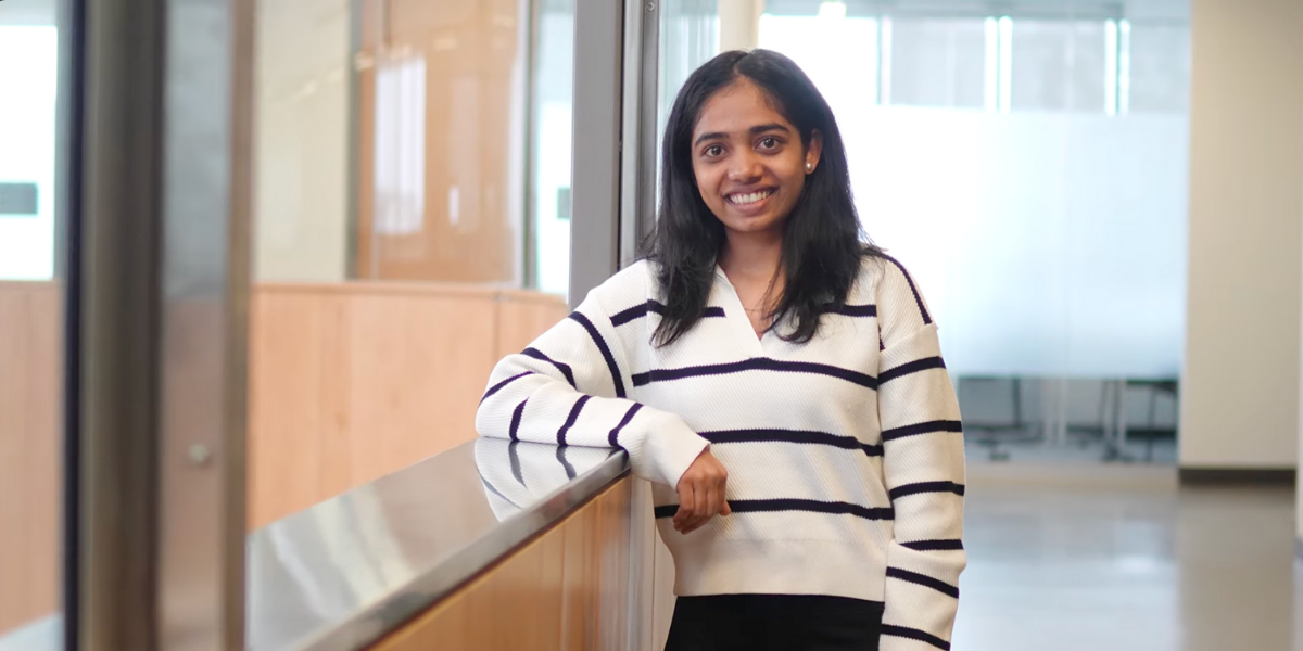 Laurentian University student Nirali Rameshbhai Babariya stands in the Parker Building smiling.