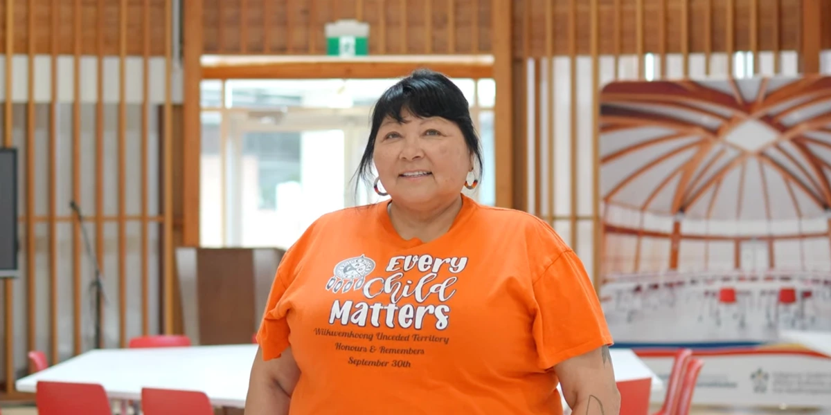 Roxanne Recollet standing in the Indigenous Sharing and Learning Centre