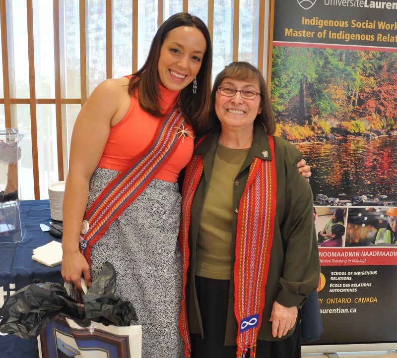 Two people smiling while at the Indigenous Student Celebration