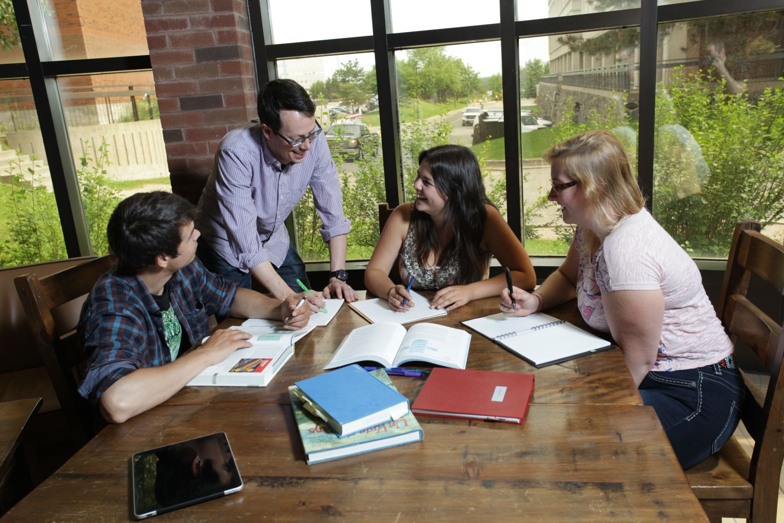 Students studying together around a table 