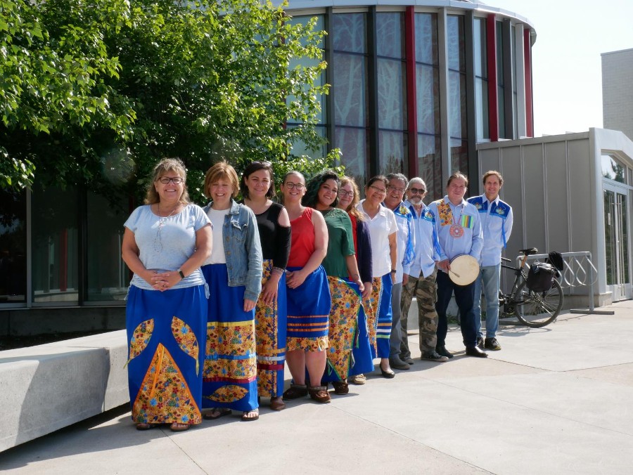 Indigenous Student Affairs team standing in a line while outside the Round Room