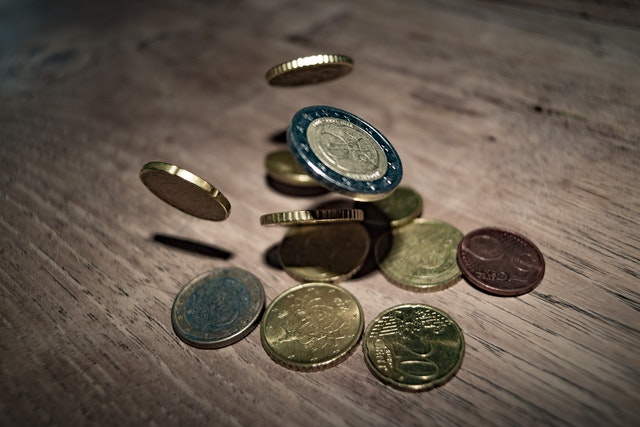 Coins on a wooden table 