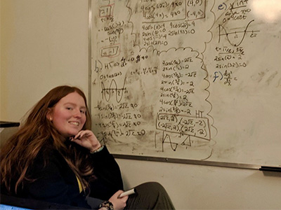 Emily Henry using a study room at Laurentian’s J.N. Desmarais Library to work on her favorite subject, Math.