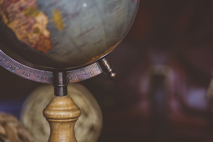 An antique globe with a blurred background.