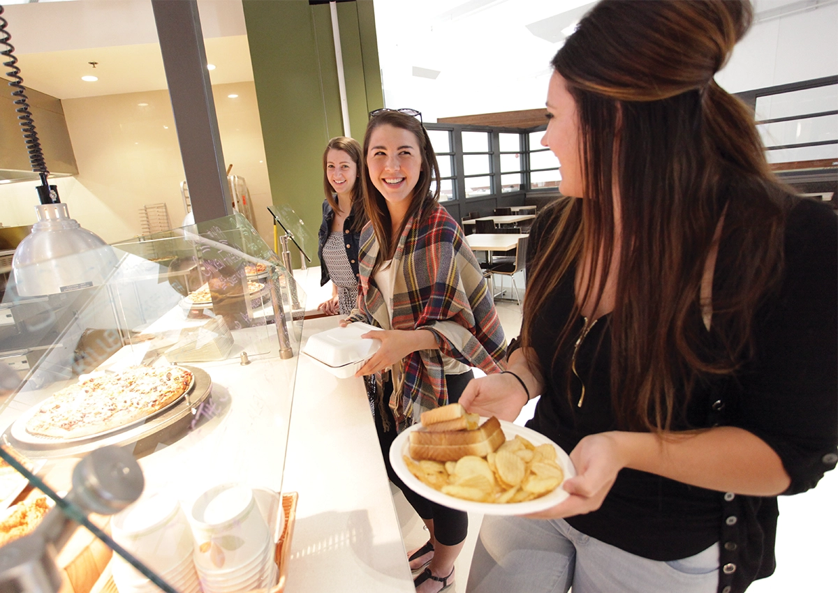 Laurentian University students getting food from the Great Hall.