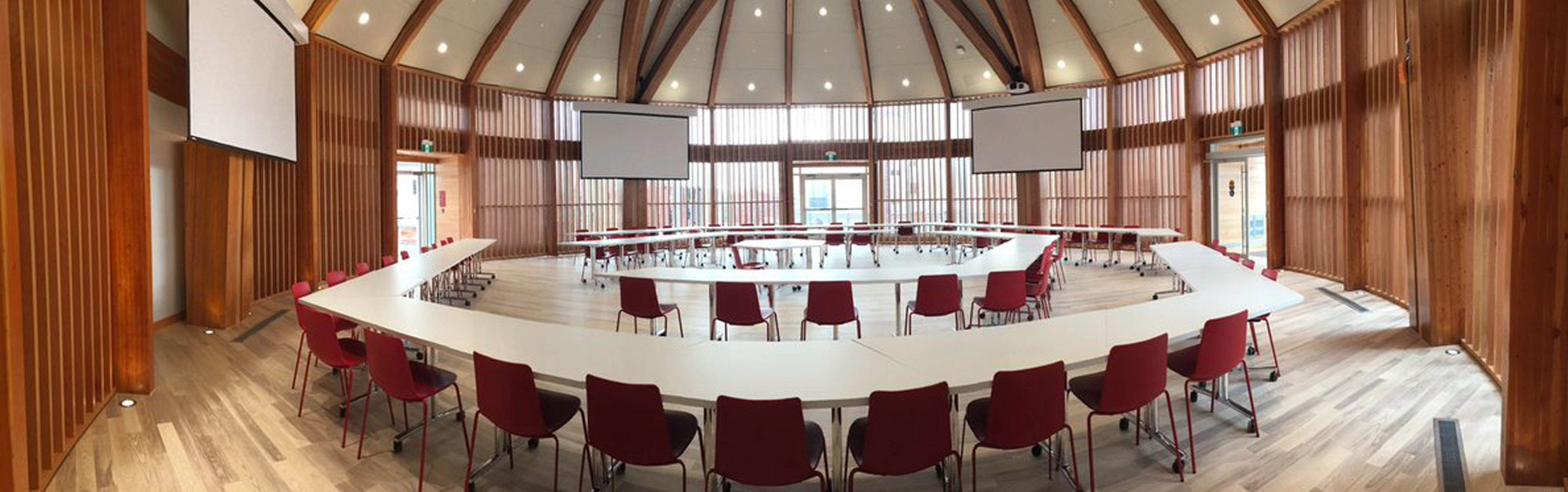 The Indigenous Sharing and Learning Centre with tables arranged in the middle of the Round Room.