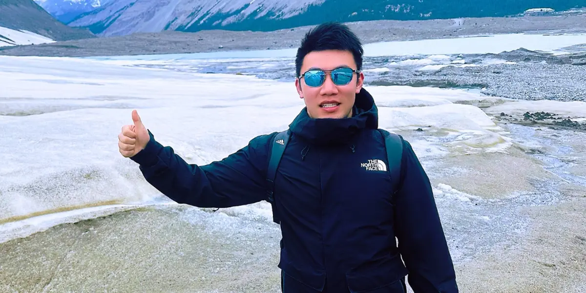 Yufeng Li outside on icy terrain.