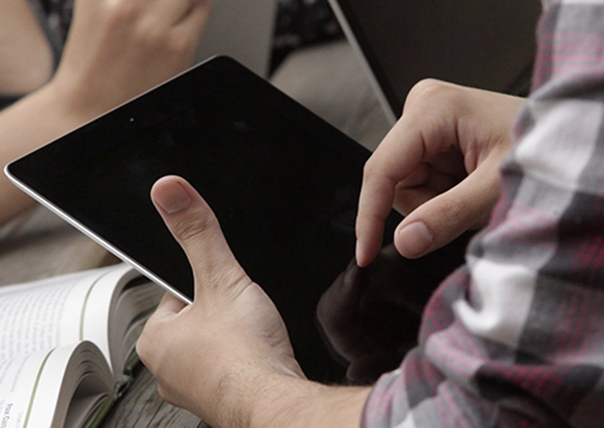 A person using an iPad.
