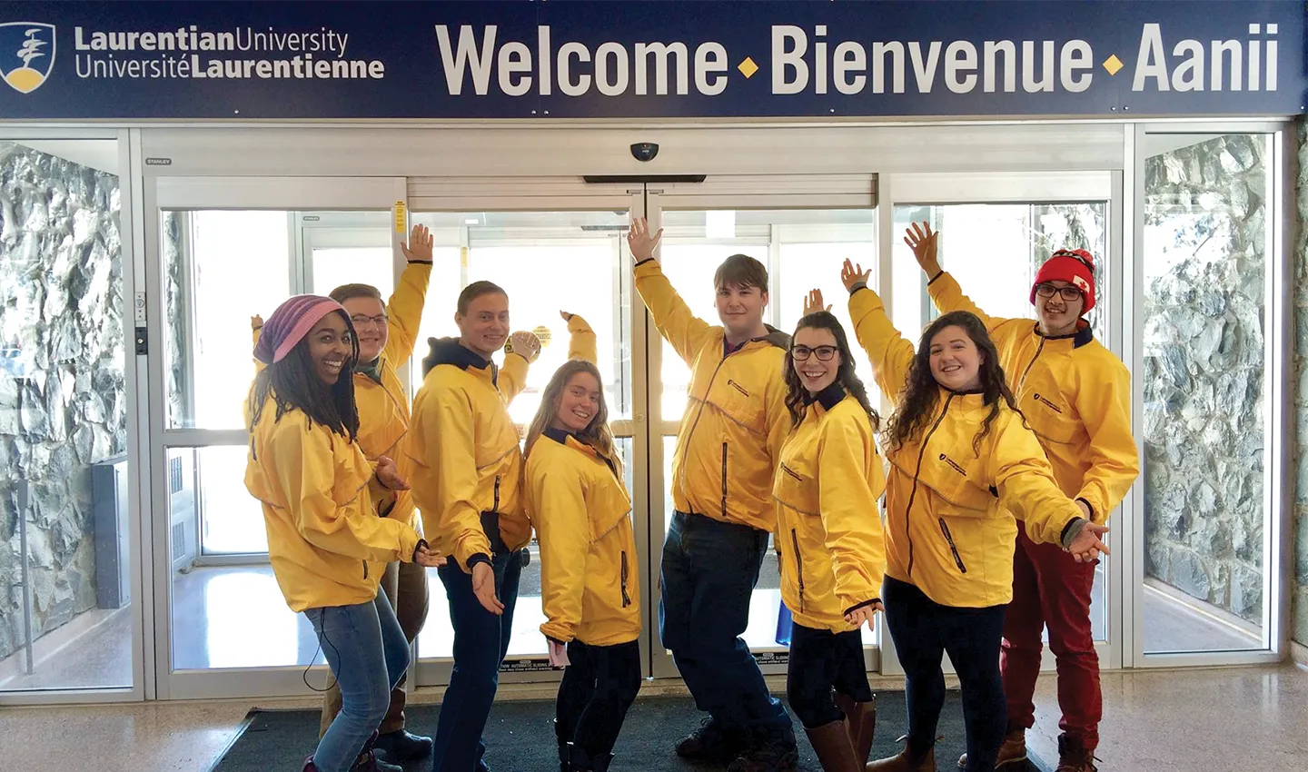 Liaison tour guides welcoming prospective students at Open House