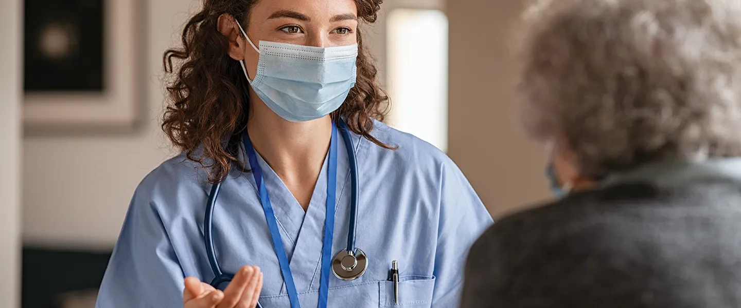 Health professional speaking with patient