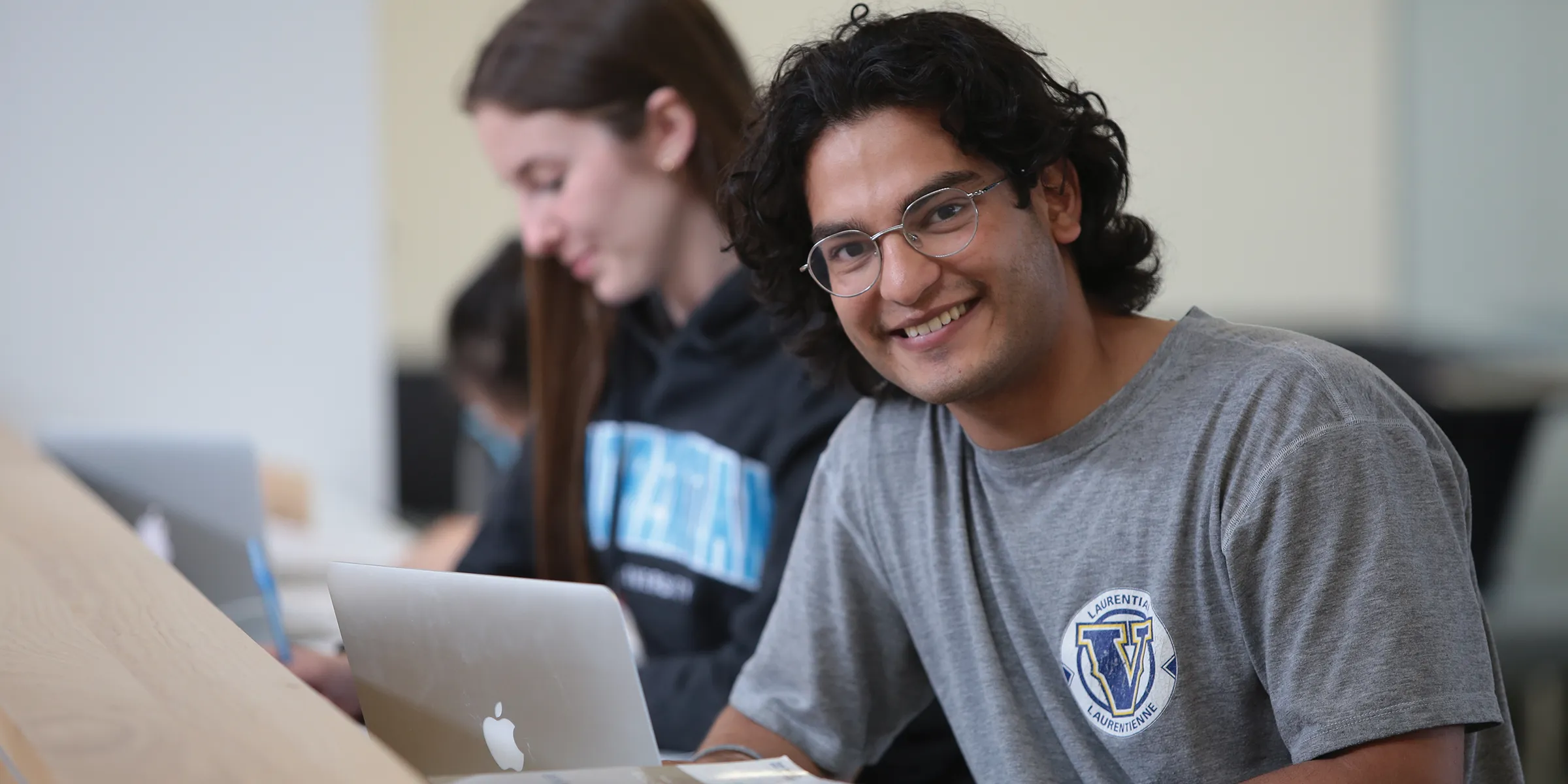 A student studying on his laptop.