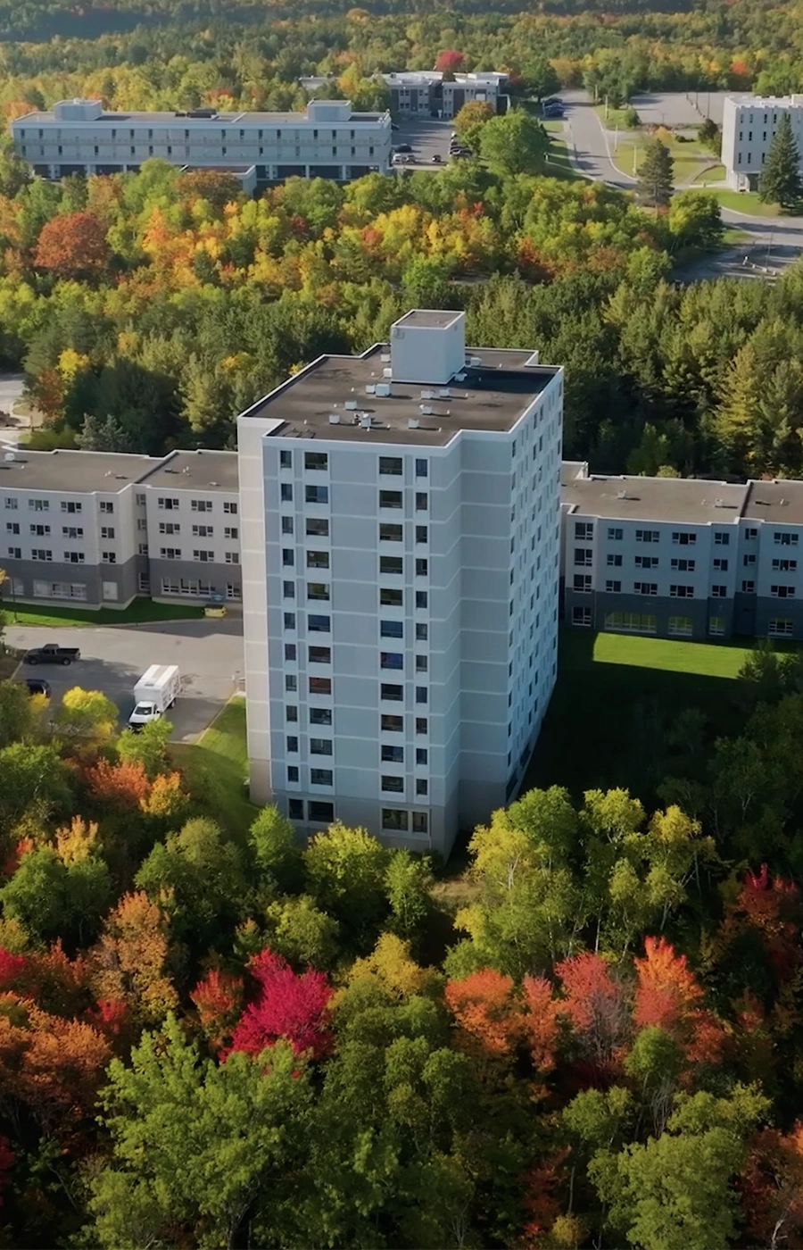 An aerial photo of Laurentian University residence buildings in the Fall.