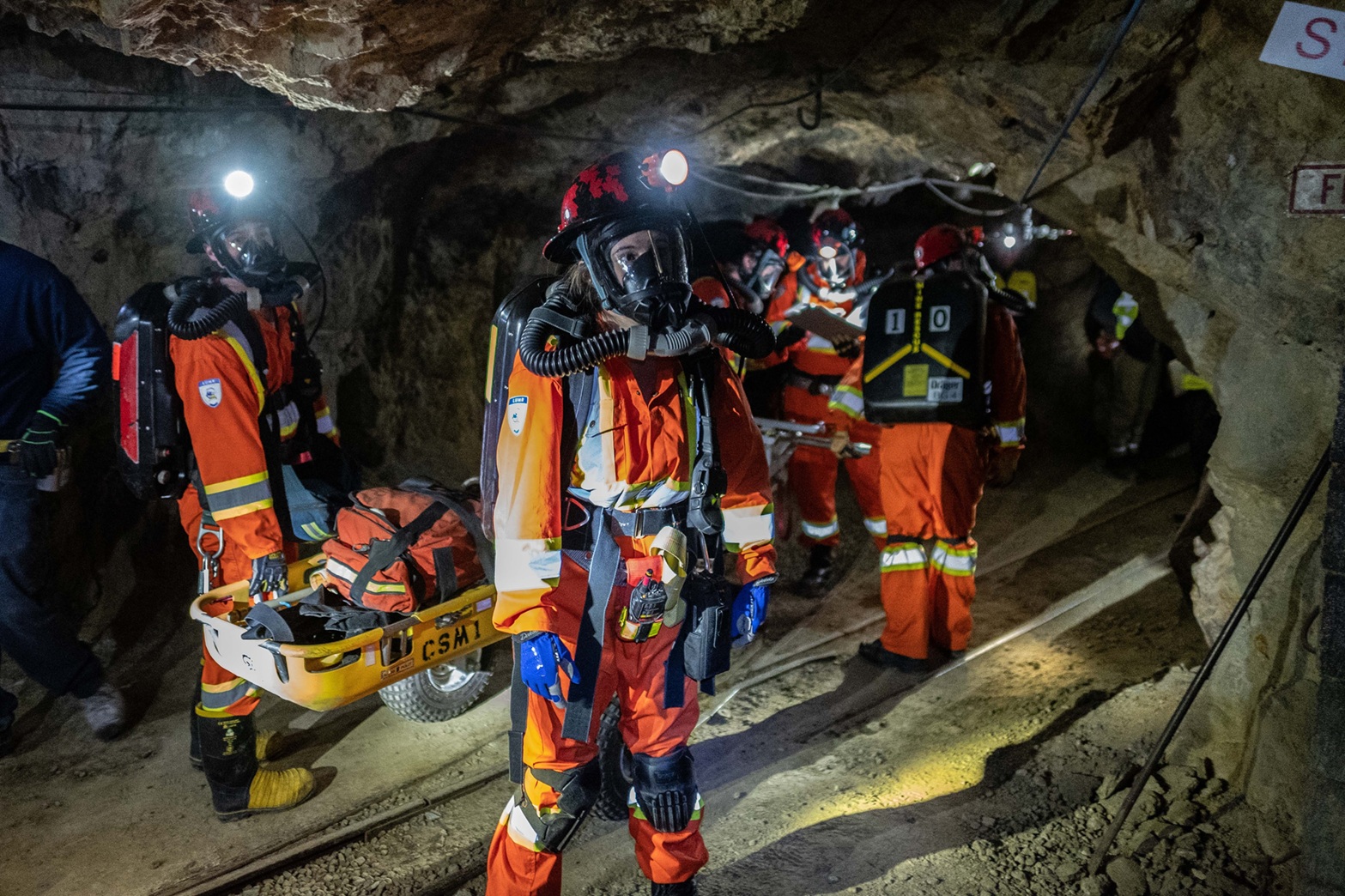 Mine Rescue team in a mine, performing a rescue