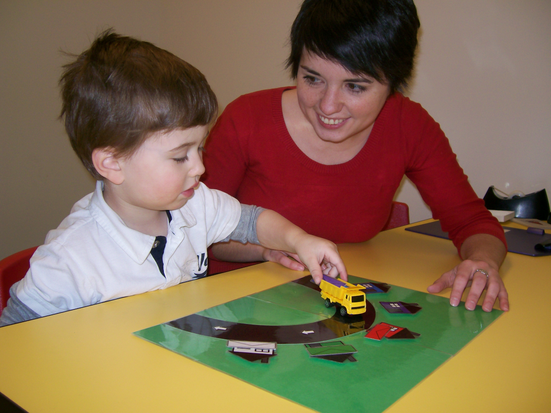 Dr Vendetti playing game with child