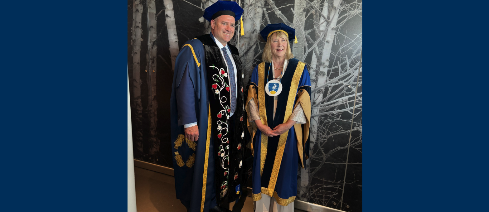 Chancellor Kristan Straub is pictured with Laurentian University President and Vice-Chancellor Lynn Wells during Spring Convocation, wearing the newly presented Ajijaak Doodem Chancellor’s Medallion.