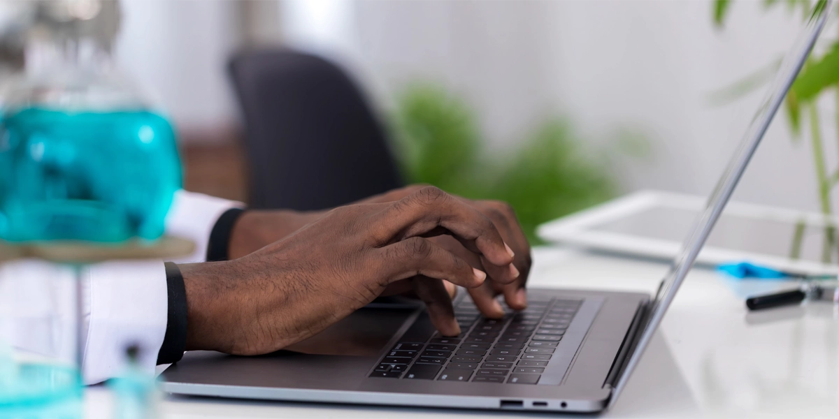 Scientist using laptop.
