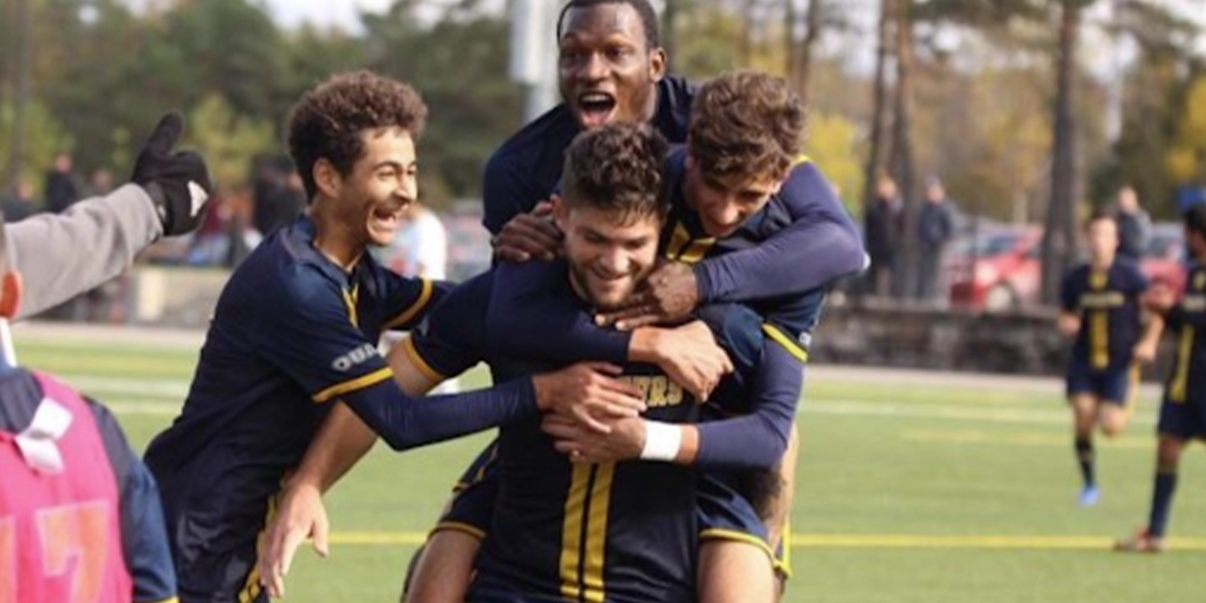Mens soccer team celebrating