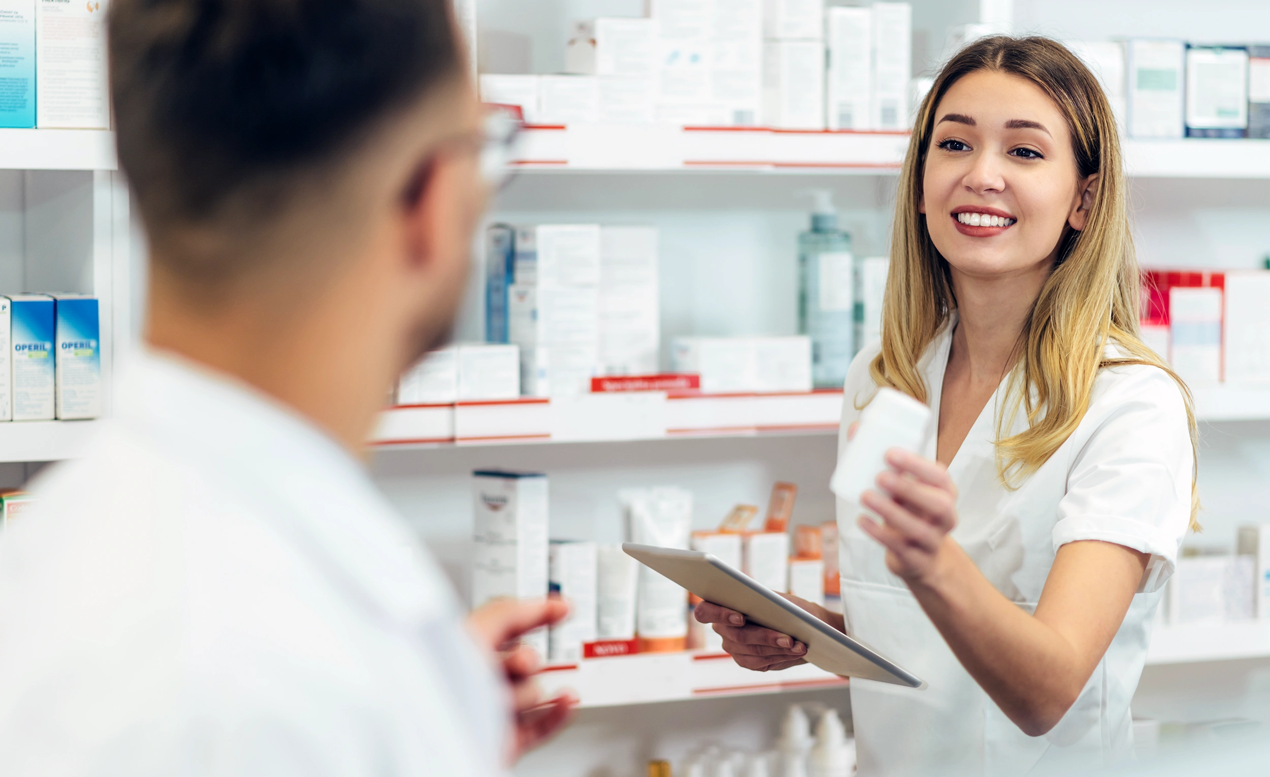 A close-up shot of a pharmacist sorting medications.