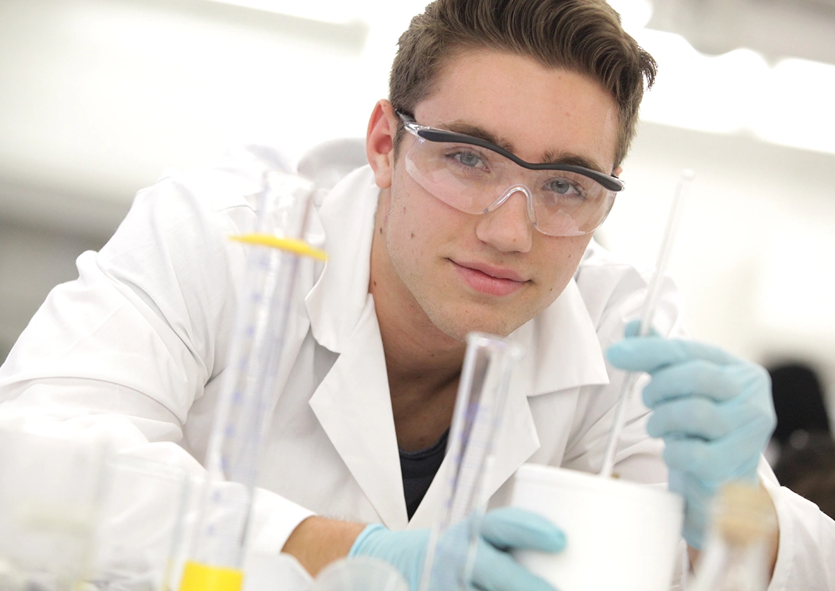 A Laurentian University student studying in a lab.