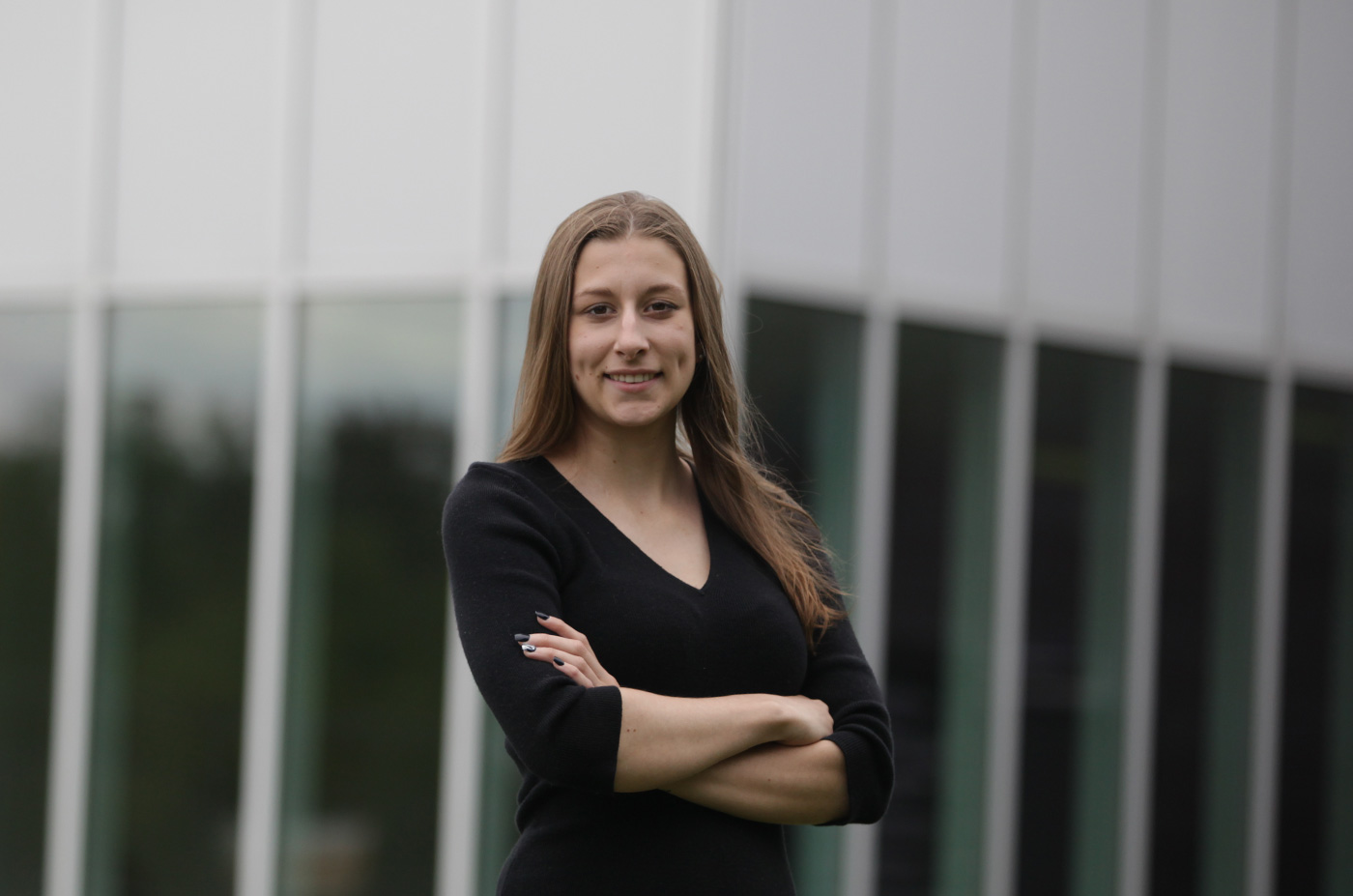 Lisa Ludwig smiling in front of a building 