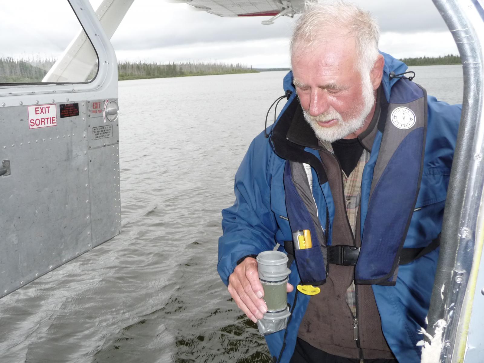 Person collecting a water sample