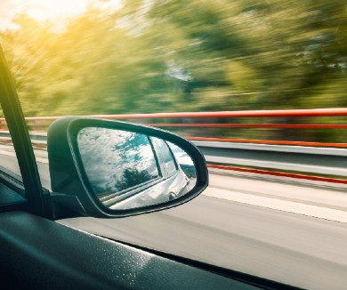 The side mirror of a vehicle while driving