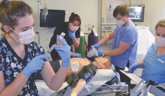nursing students participate in a lab
