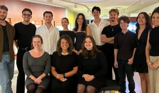 A group of McEwen Architecture students and professors smiling.