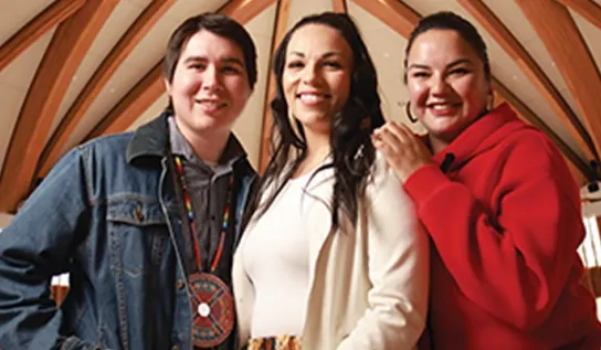three indigenous students stand in the Indigenous sharing and learning centre