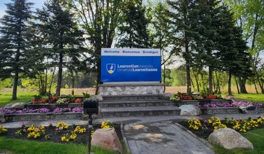 The garden and Laurentian University sign at the campus entrance.