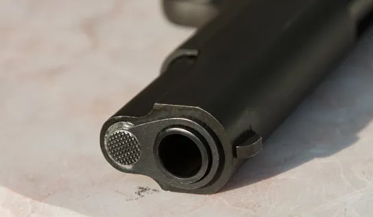 The barrel of a gun.