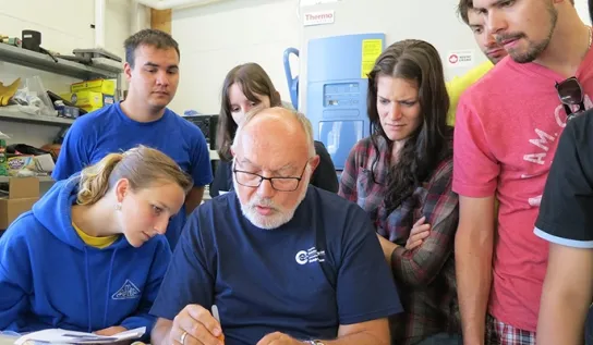 students watch a professor give a tutorial