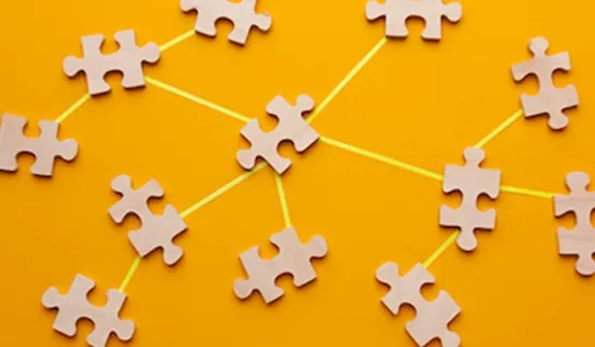 puzzle pieces on a yellow backdrop