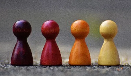 board game pawns arranged in a line