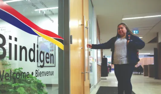 An Indigenous student entering the Indigenous Sharing and Learning Centre at Laurentian University.