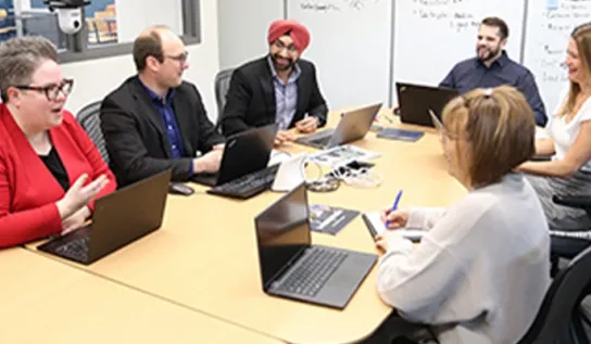 a group of staff in a meeting