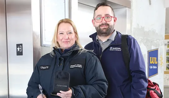 Two Laurentian University campus security guards smiling.