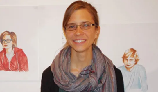 Mariana Lafrance displaying her artwork.