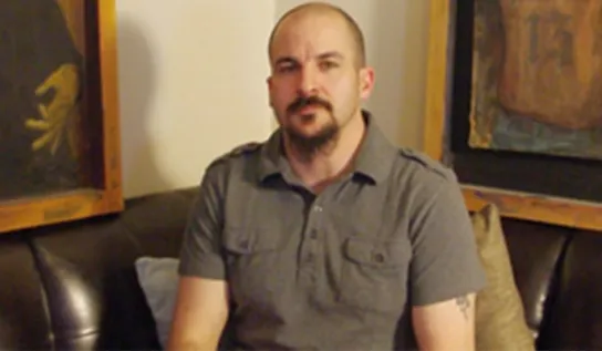 Peter Mihaichuk displaying his artwork.