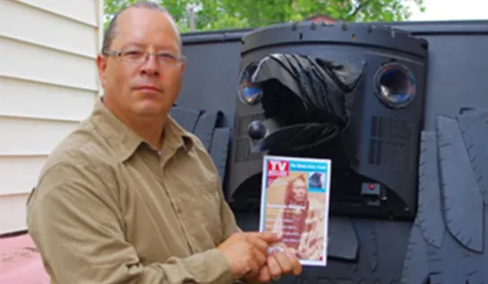 Will Morin displaying his artwork.