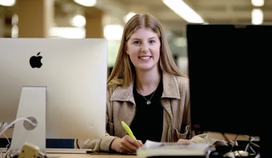 A Laurentian University student studying in the J.N. Desmarais Library.