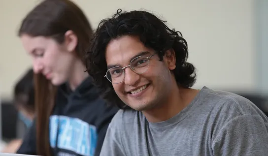 A Laurentian University student studying on campus.