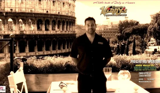 Chris Vitiello with the colosseum behind him 