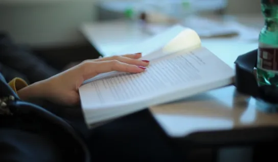 Hand holding a book