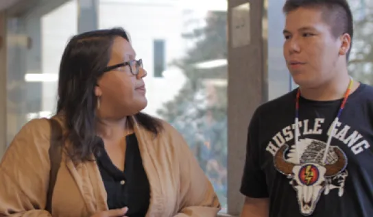 Indigenous faculty with a student 