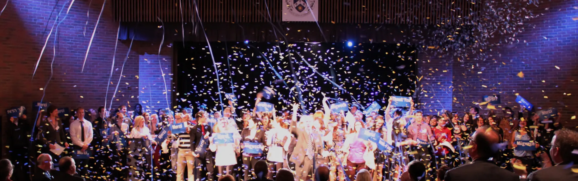 People in room celebrating with confetti