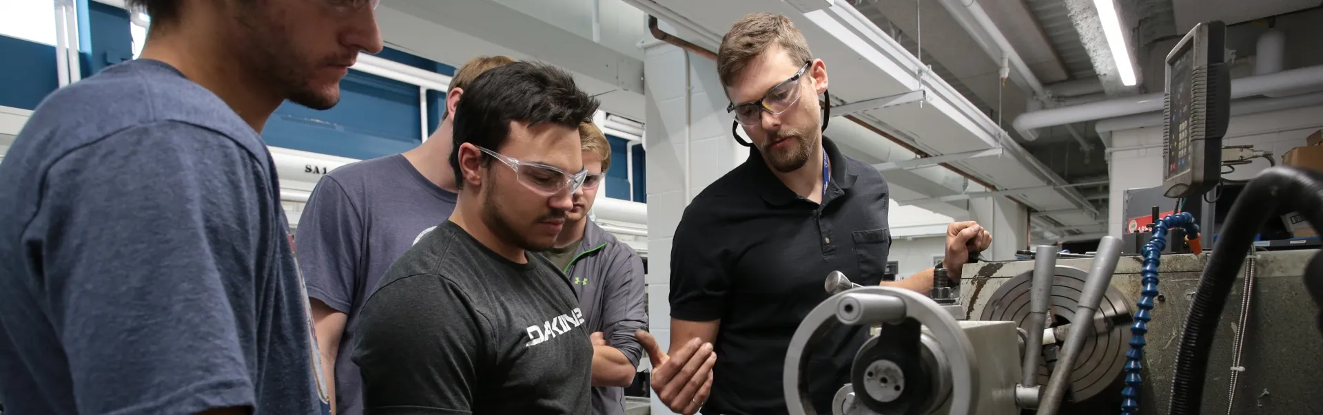 Students and a labtech in a Mechanical Engineering lab