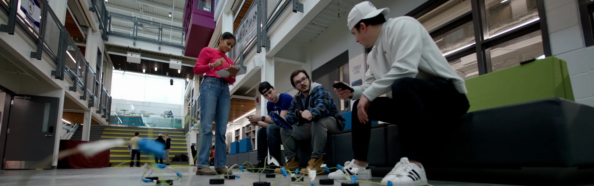 Students in the Cliff Fielding building space performing an experiment