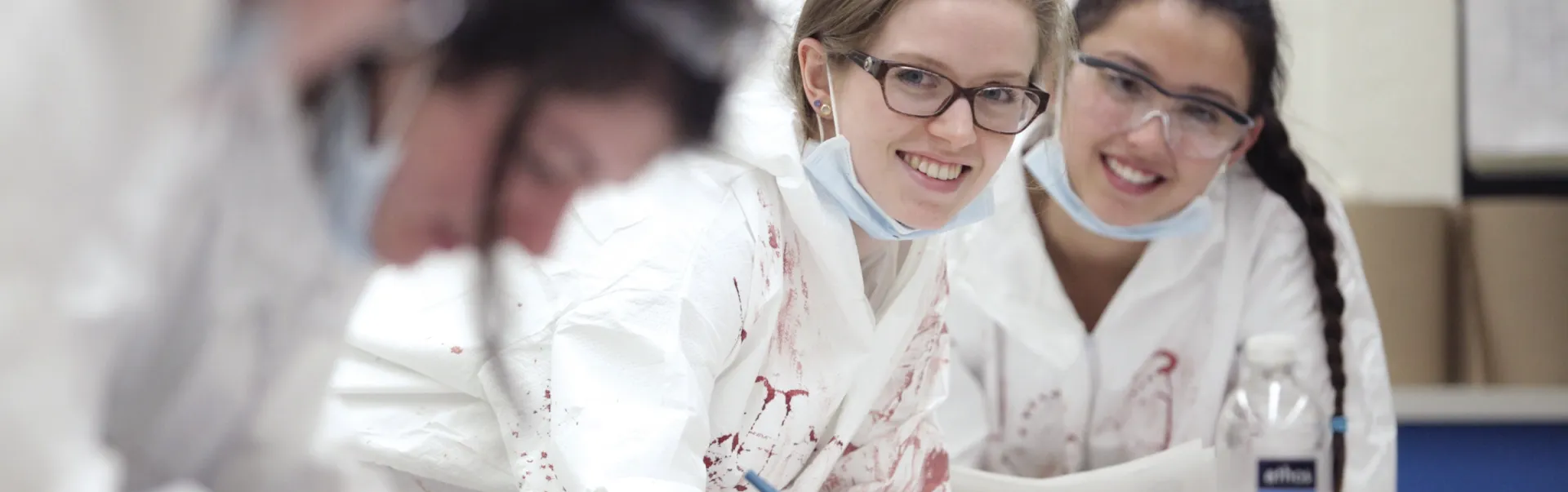 Forensic Science students during a blood splatter lab.